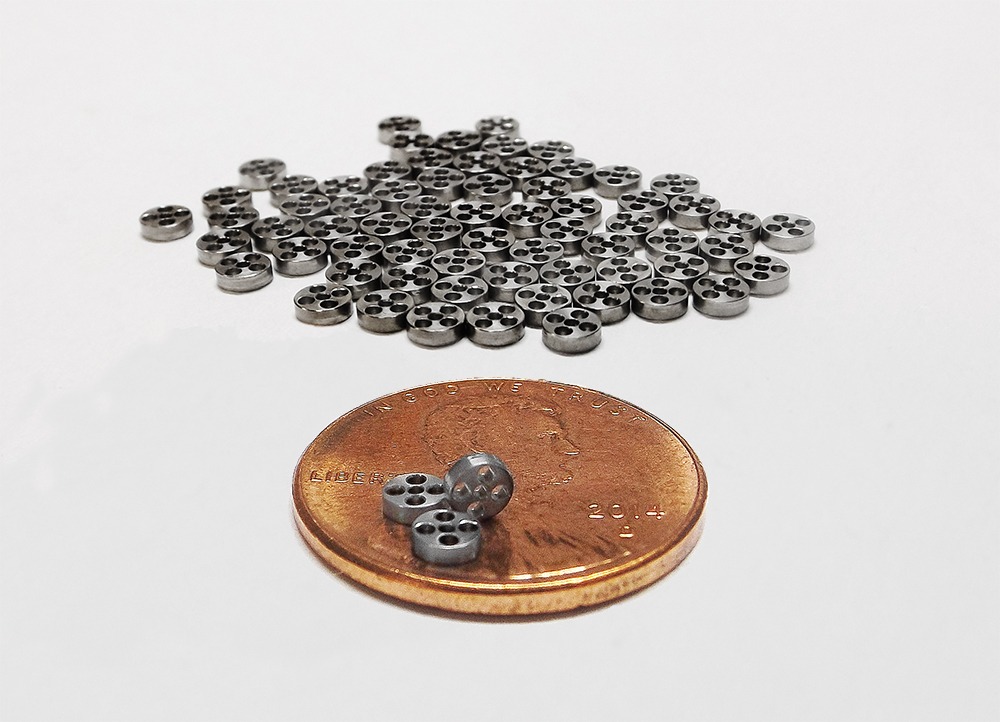 Precision CNC Micromachined Steel Components On Penny